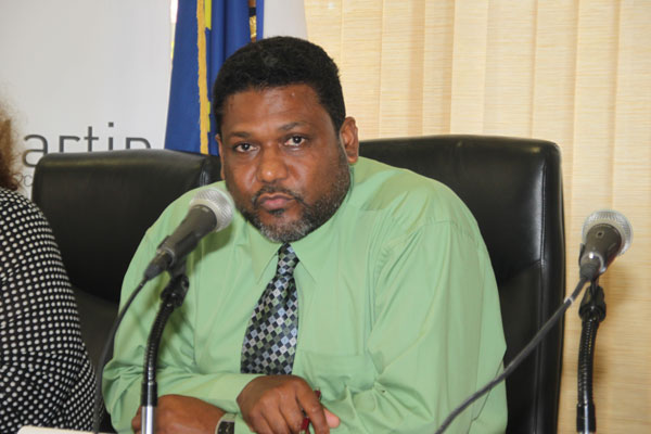 President of the COM Alain Richardson speaking to reporters on Tuesday about the recent scandal surrounding his Director of Cabinet Alex Richards. alainrichardson10042012