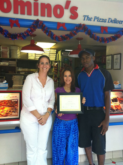 Saying thank you to Domino’s Pizza: Tanya Frederiks (left), Kilee Mercuur (CIA president) and Harold Tucker (right). dominosreceivescertificatefromusgf15012012