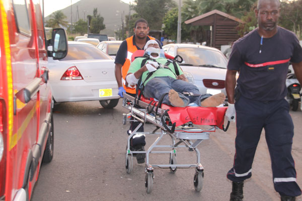 One of the victims being transported to the ambulance. fqmotorcycleaccidentvictim28012012