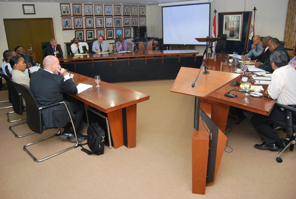 The Minister of Finance and Ministry of Finance officials as well as others listening attentively to the presentation by APS board and management in the Dr. A.C. Wathey Hall. (DCOMM Photo) hshigemotomeetspensionfundboard16012012