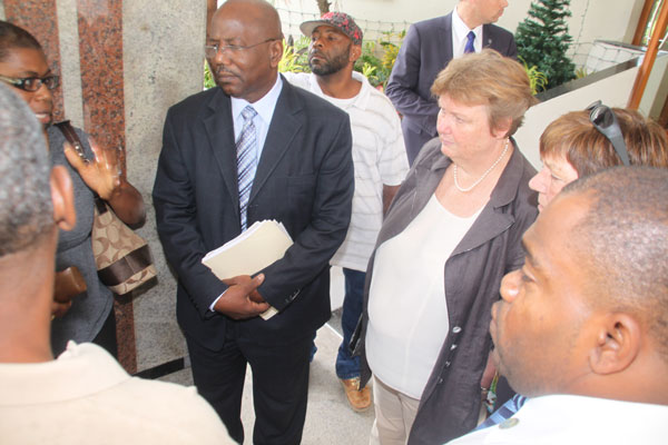 Member of Parliament William Marlin and Dutch Members of Parliament Brigitte van der Burg and Marijke Linthorst listening to the Pelican Workers on Thursday in front of the Great Bay Resort. mpslisteningtopelicanworkers12012012