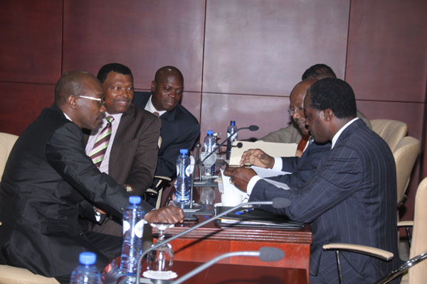 Members of the National Alliance in Parliament and Independent Member Frans Richardson waiting for the official opening of the meeting on Tuesday. nafactionmembers24012012