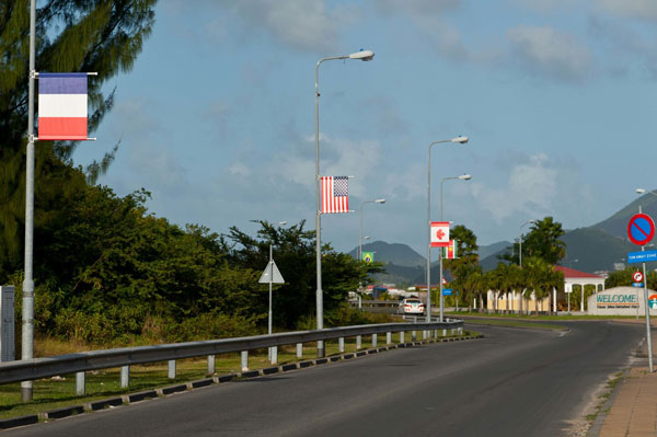 Flags along main road leading to Princess Juliana International Airport (PJIA). (PJIA photo) pjiaflags08012012