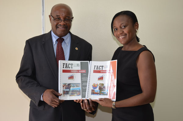 Left to right, Minister Hon. Romeo Pantophlet and Makini Hickinson. romeopantophletreceivescopyofstatisticalmagazine22082012