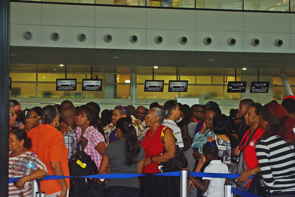St. Maarten students departing for their freshman-year university studies in the Netherlands, at Princess Juliana International Airport with family and friends (7/29/12). (PJIAE Photo) sxmstudentsatpjiaebeforeleaving29072012
