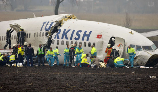 Rescue workers helping passengers after a Turkish Airlines passenger plane crashed during landing at Amsterdam's Schiphol airport on Wednesday. (Paul Vreeker/Reuters). 25amsterd550