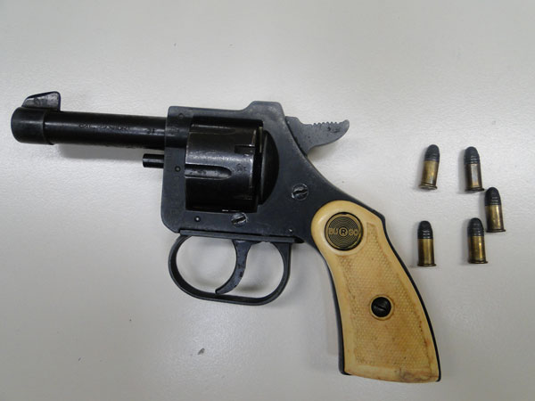 Confiscated weapon and ammunition. confiscatedweapon20042011