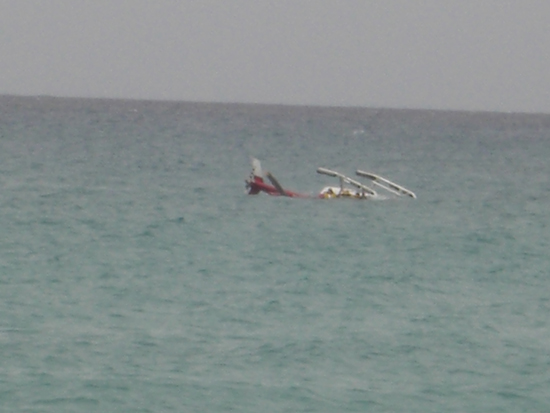 The helicopter in the water as it landed. crash