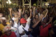 AFP/File – People celebrate in Pointe-à-Pitre on March 04 in Guadeloupe after a general strike that had paralysed … guadaenstrike