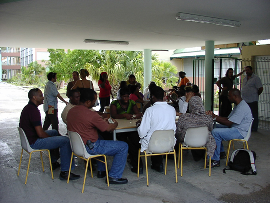 Teachers Playing dominoes on the school grounds yesterday. lyceestrike