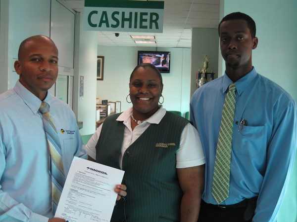 Mr. Dwight Williams (first customer to fill out the questionnaire), NAGICO Life Department Administrative Assistant Eldrika Richardson and Calvic David. nagicocustomersurvey11022011