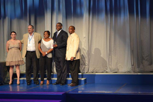 St. Maarten’s delegation (from right PJIAE Interim Managing Director Mr. Larry Donker, Minister Franklin Meyers and Tourism Bureau Director Ms. Regina Labega) with Routes officials, accepting the award. sxmdelegation15022011