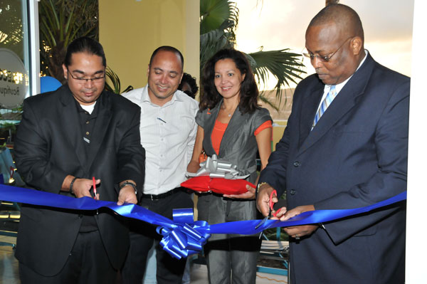 Ribbon cutting ceremony officially launching the TELECOM Boutique. Project Leader Suraj Ramdas, Chief Commercial Officer Brian Mingo, Chief Financial Officer Helma Etnel, and Chairman of the Board Raphael Boasman. telecomboutique28022011