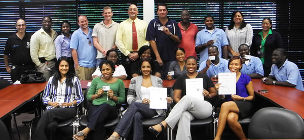 UTS Interim COO Roy Richardson and Red Cross Commander Julia Boasman, who assisted in handing out the certificates, surrounded by the participants of the various courses. utsemployeesredcrosstraining20092011