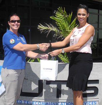 UTS Marketing and Communications Officer, Ivy Lambert presenting Regatta Director, Heather Tackling with the Chippie SIM cards that Regatta staffers will use throughout the regatta to coordinate activities. utsregattadonation17022011
