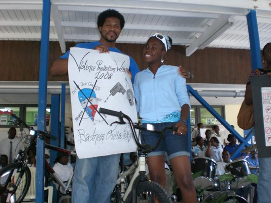 Terry Peterson and student showing the 2008 winning poster. winningposter2008