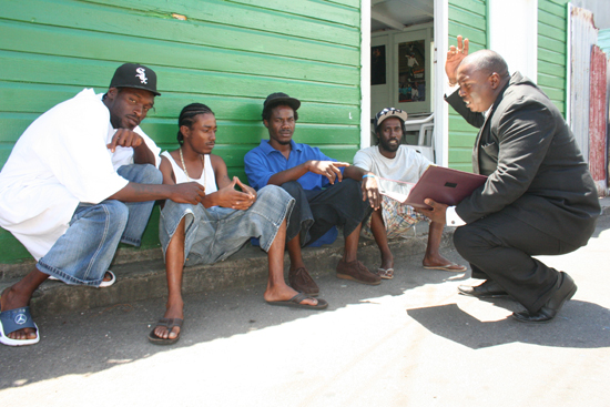 Desmond Herbert in deep discussion with some young men from the Mac Knight community. youngmenfrmcknight