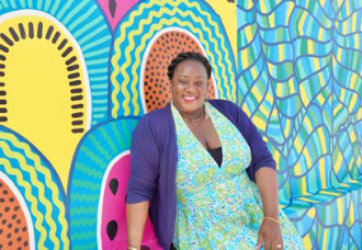 Zillah Duzon-Hazel completes new mural design.