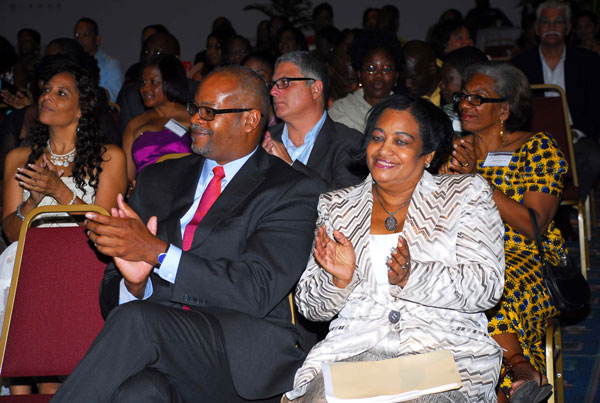 PJIAE Managing Director Regina LaBega (R, front) joins guests in applauding Toastmasters for a highly successful Toastmasters District 81 Conference 2012. Minister of Health Cornelius de Weever is seated to the right of Ms. LaBega. (PJIAE photo) rlabegaattoastmastersdistrict81conference23052012