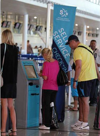 passengersusingselfservicekiosksatpjiae01032013