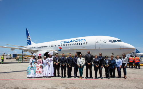 (L to R) - Cultural performers, Captain Marcelo Gallino and crew, PJIAE CEO Brian Mingo, President of the Tourist Office and Terriorial Councillor, Valerie Damaseau, Minister of VSA, Omar Ottley, Copa crew, Management of Halley Aviation Services, Ariana and Priscilla Halley and St. Maarten Tourist Bureau Rep, Gianira Arrindell copapjiae01062022