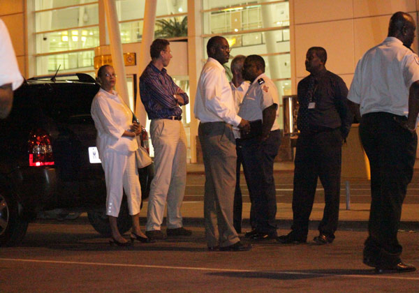 Authorities standing in front of the PJIAE Building. authorities19022010