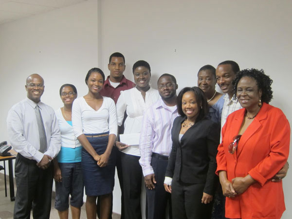 Recipients posed with members of JFE after receiving supplementary scholarship funds. jfegrants29062011